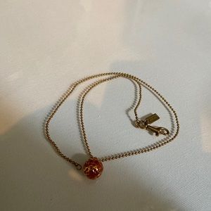 Red coach globe necklace ball